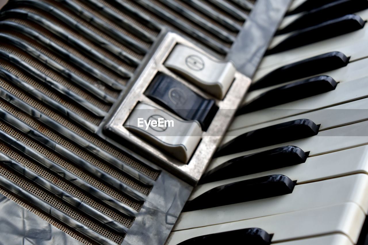High angle view of accordion with buttons
