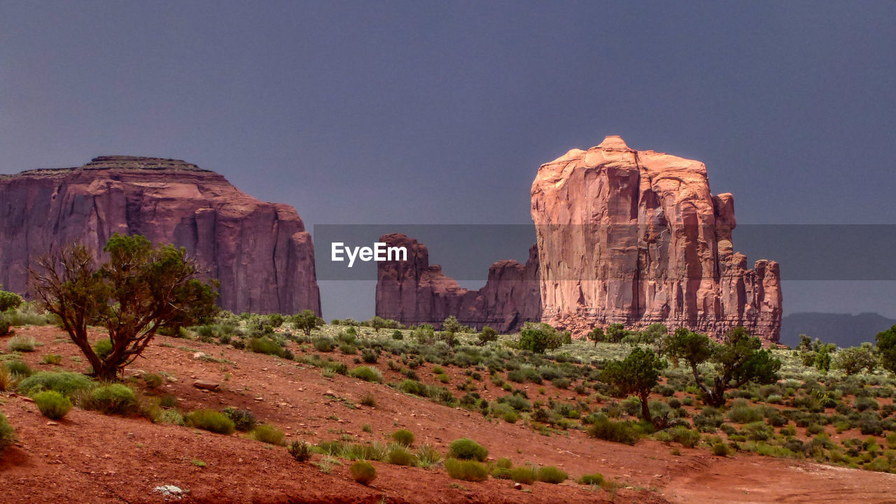 Rock formations on mountain against sky