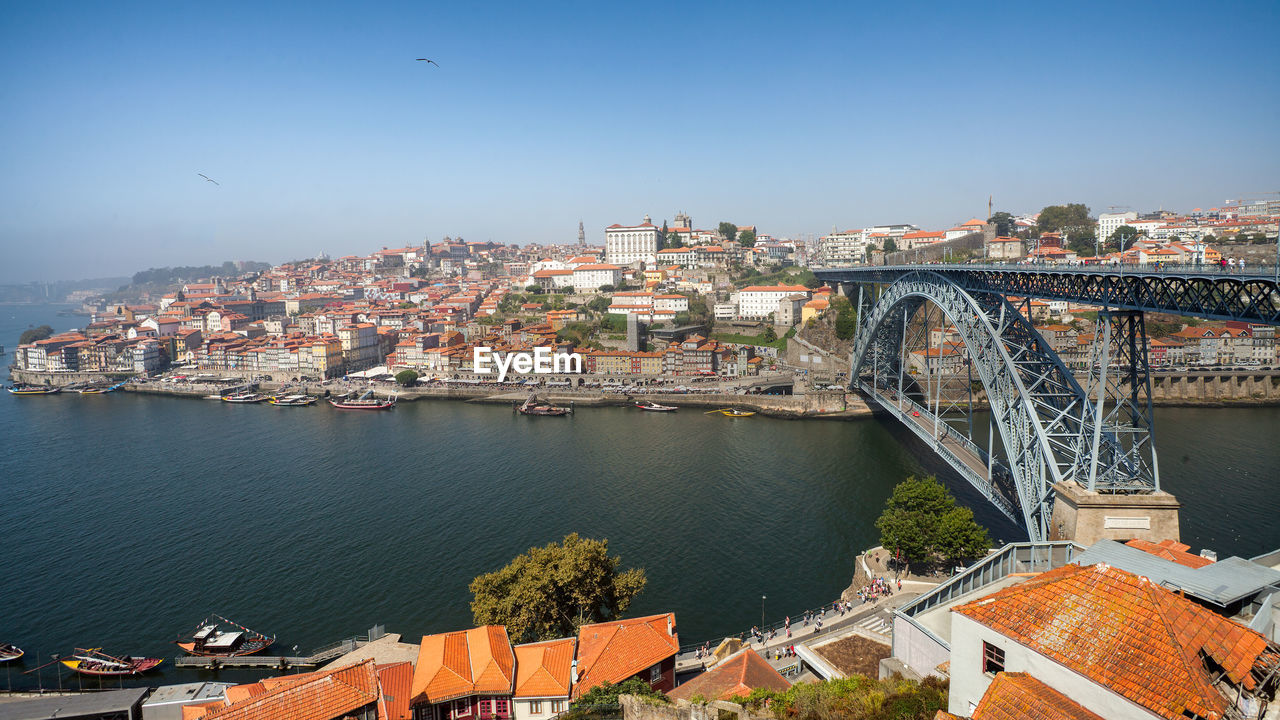 High angle view of bridge over river and buildings in city