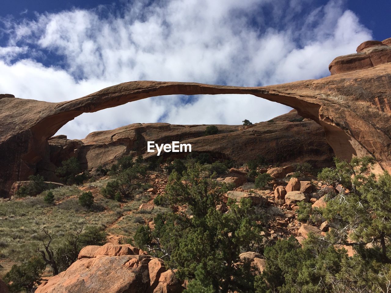 Scenic view of mountain against cloudy sky