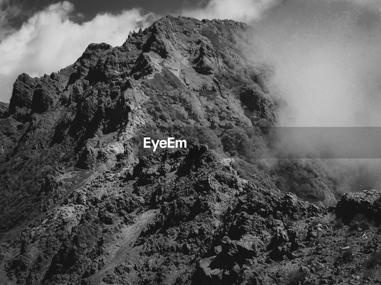 Low angle view of rock formations against sky