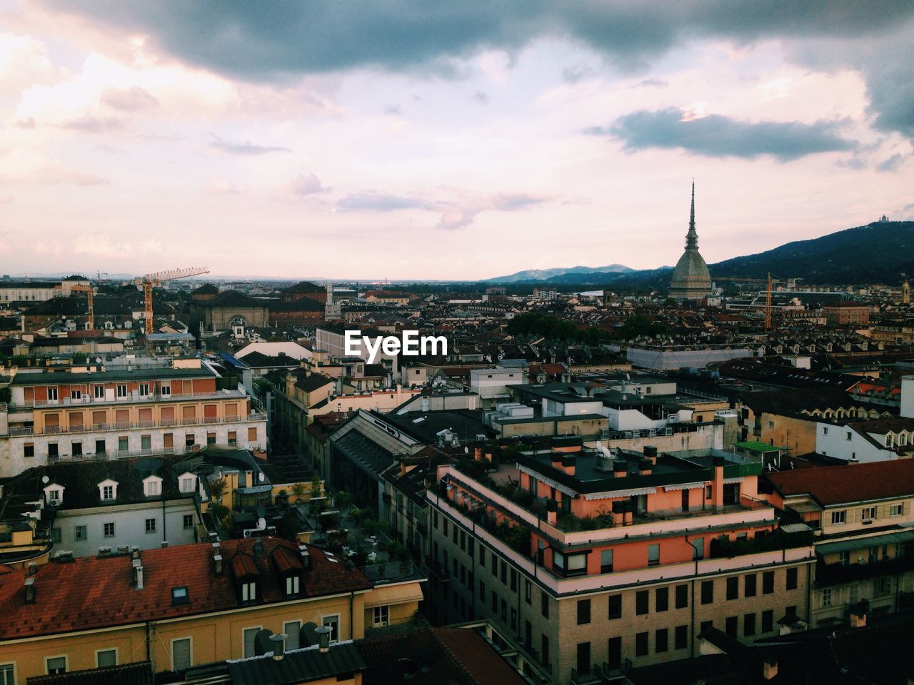 High angle view of townscape against cloudy sky