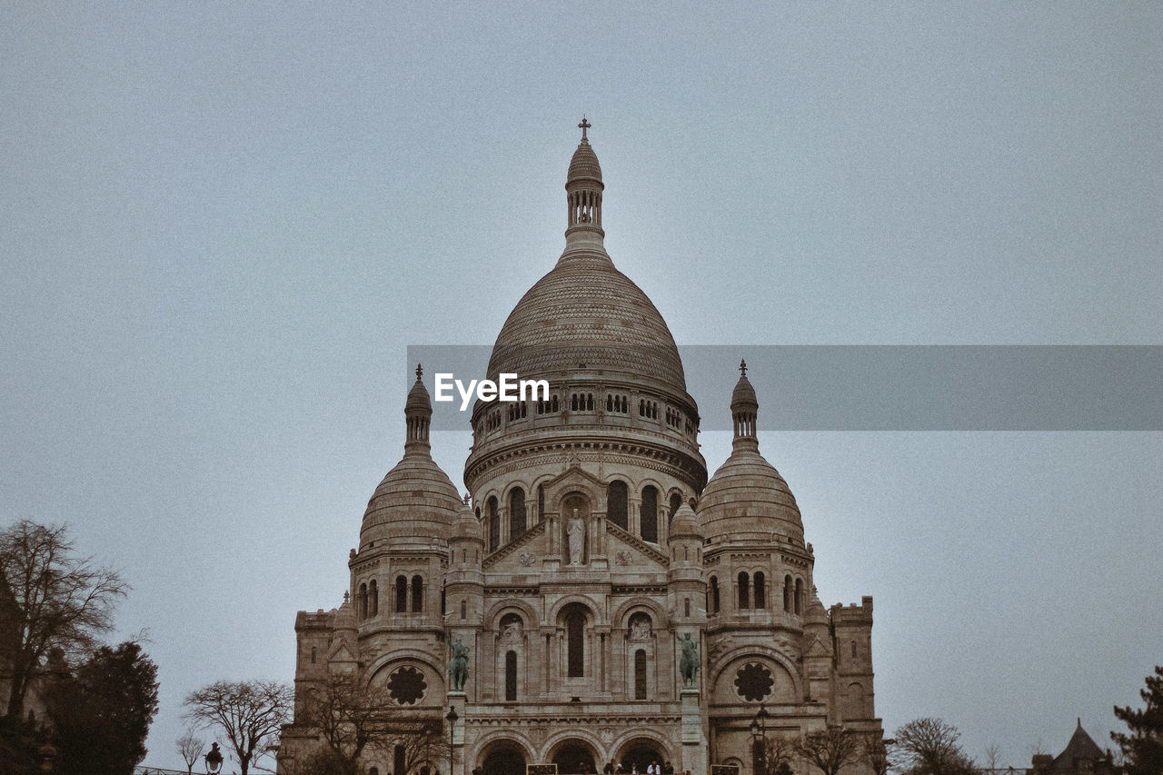 Low angle view of historic church against clear sky