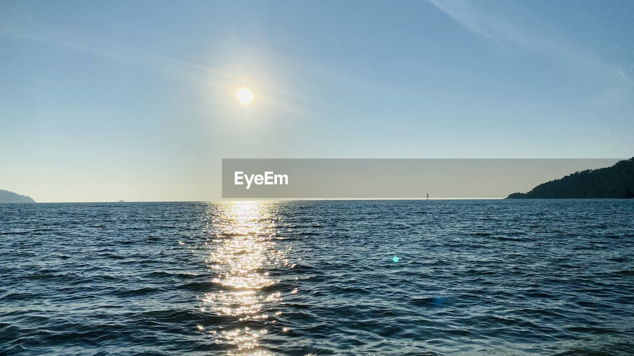 water, sky, sea, horizon, ocean, beauty in nature, scenics - nature, nature, tranquility, horizon over water, sunlight, tranquil scene, sun, idyllic, shore, wave, coast, no people, blue, seascape, rippled, body of water, outdoors, travel, reflection, wind wave, sunset, clear sky, environment, cloud, land, dusk, travel destinations, bay, day