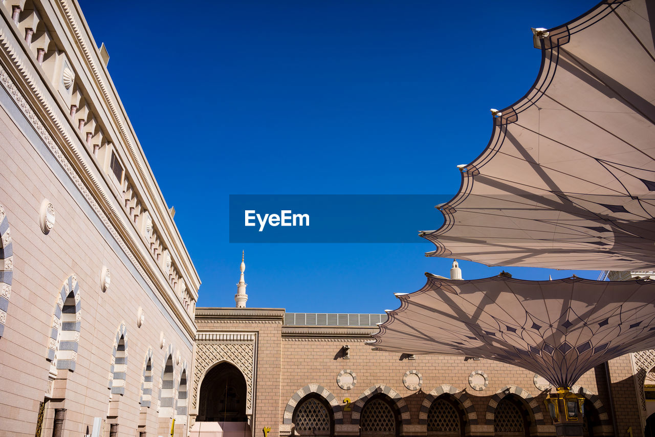 LOW ANGLE VIEW OF CHURCH AGAINST CLEAR BLUE SKY