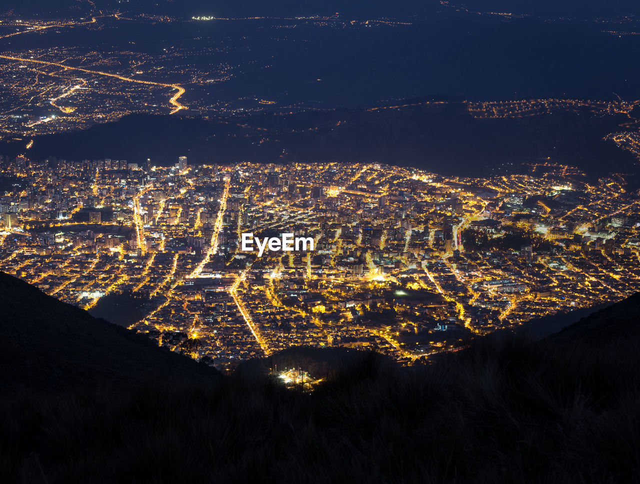 High angle view of illuminated cityscape at night