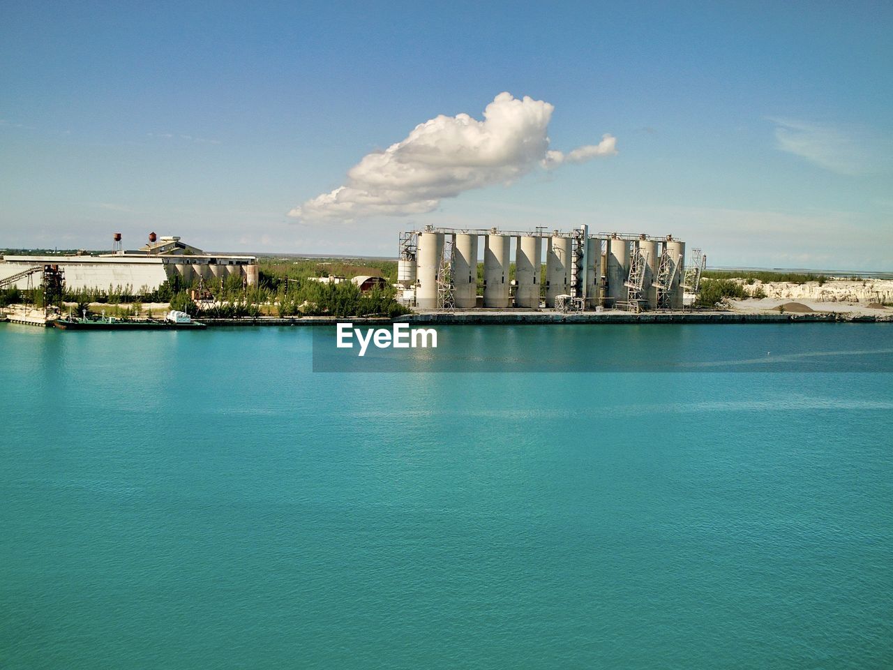 View of buildings in city against cloudy sky