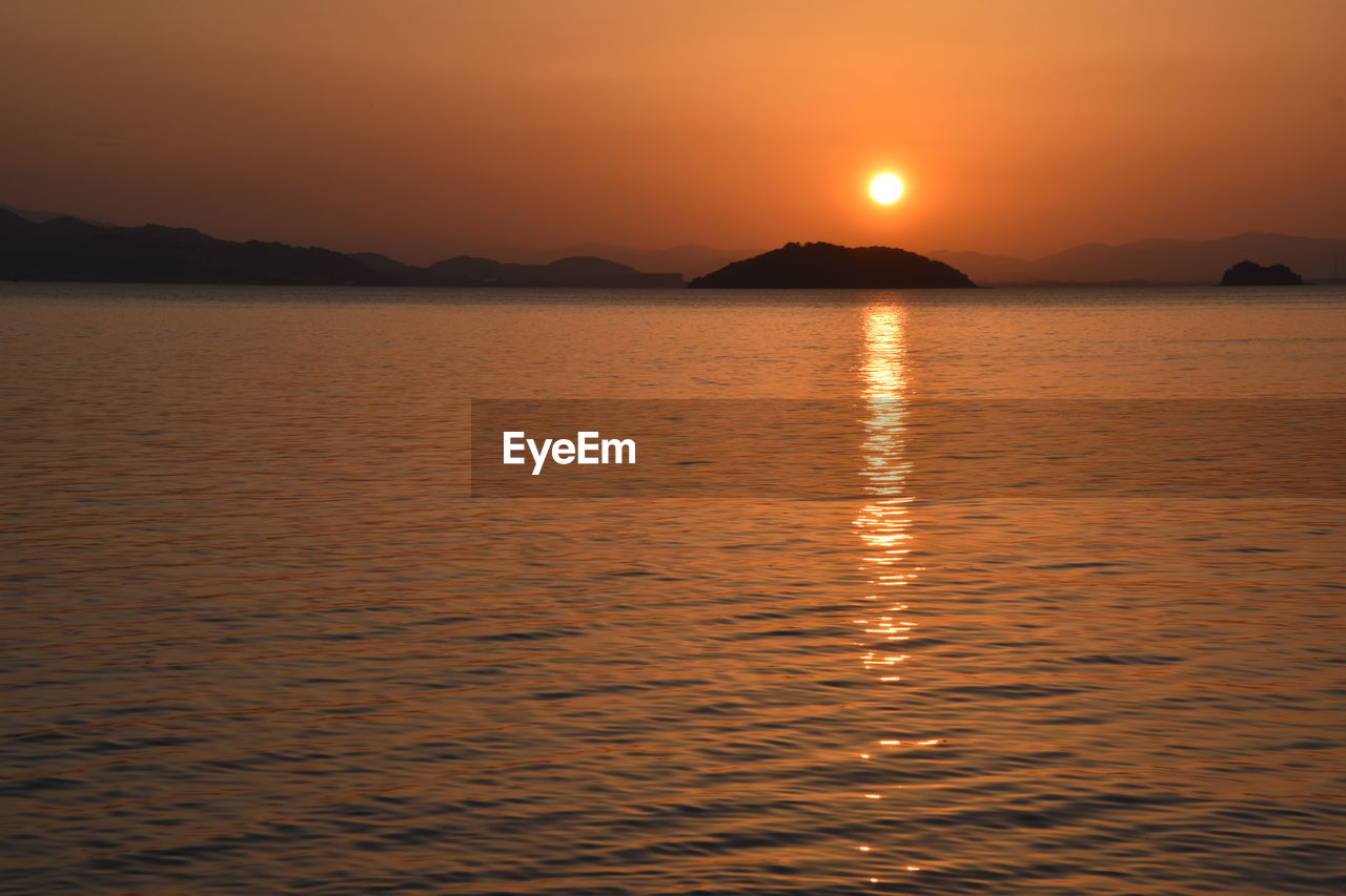 SCENIC VIEW OF SEA DURING SUNSET