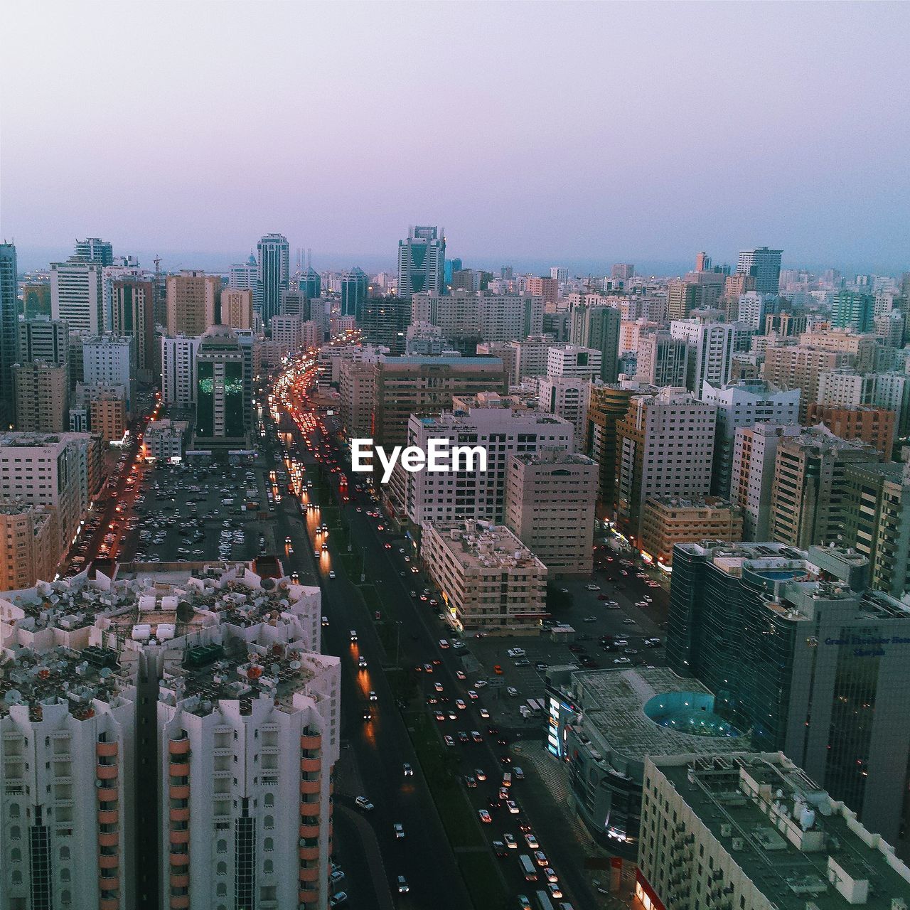 High angle view of cityscape against clear sky at dusk