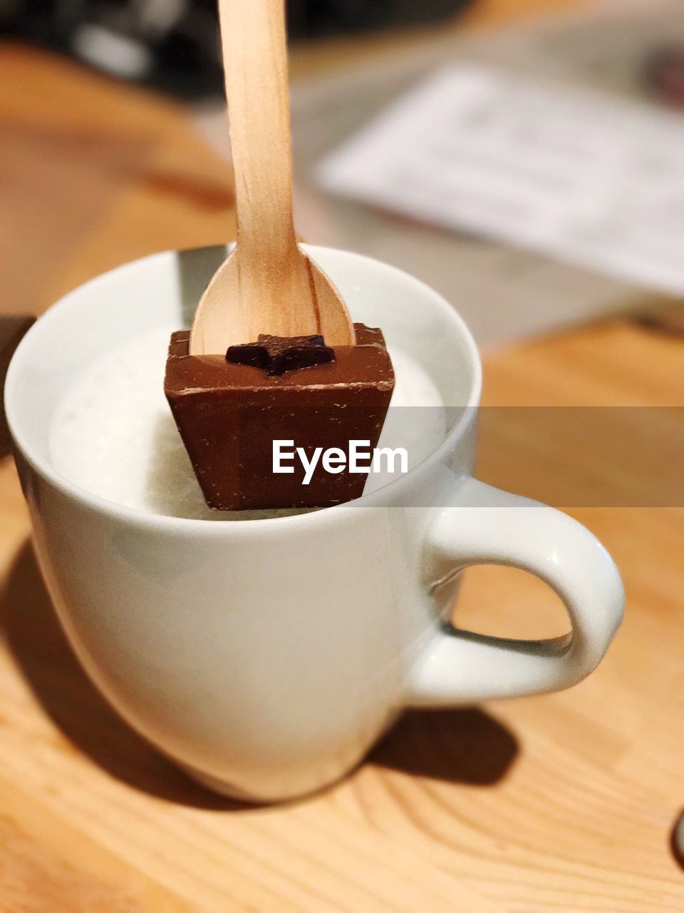 CLOSE-UP OF DRINK IN PLATE ON TABLE