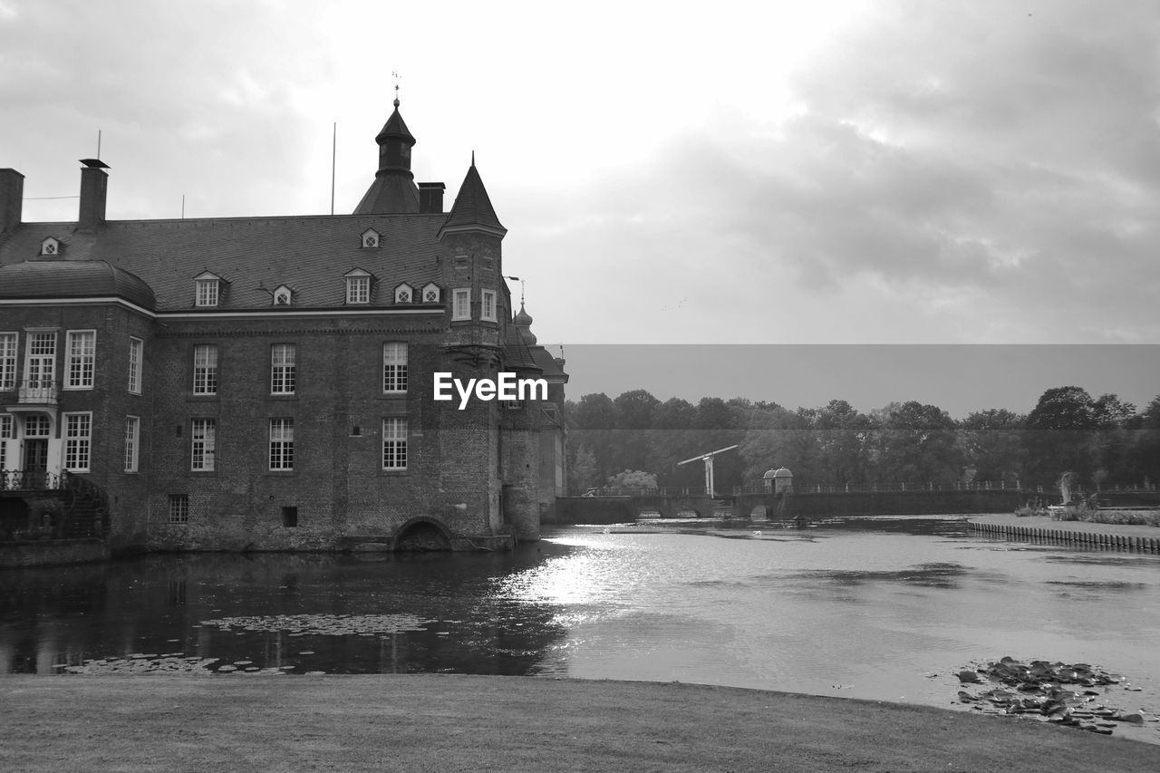 VIEW OF BUILDINGS BY RIVER