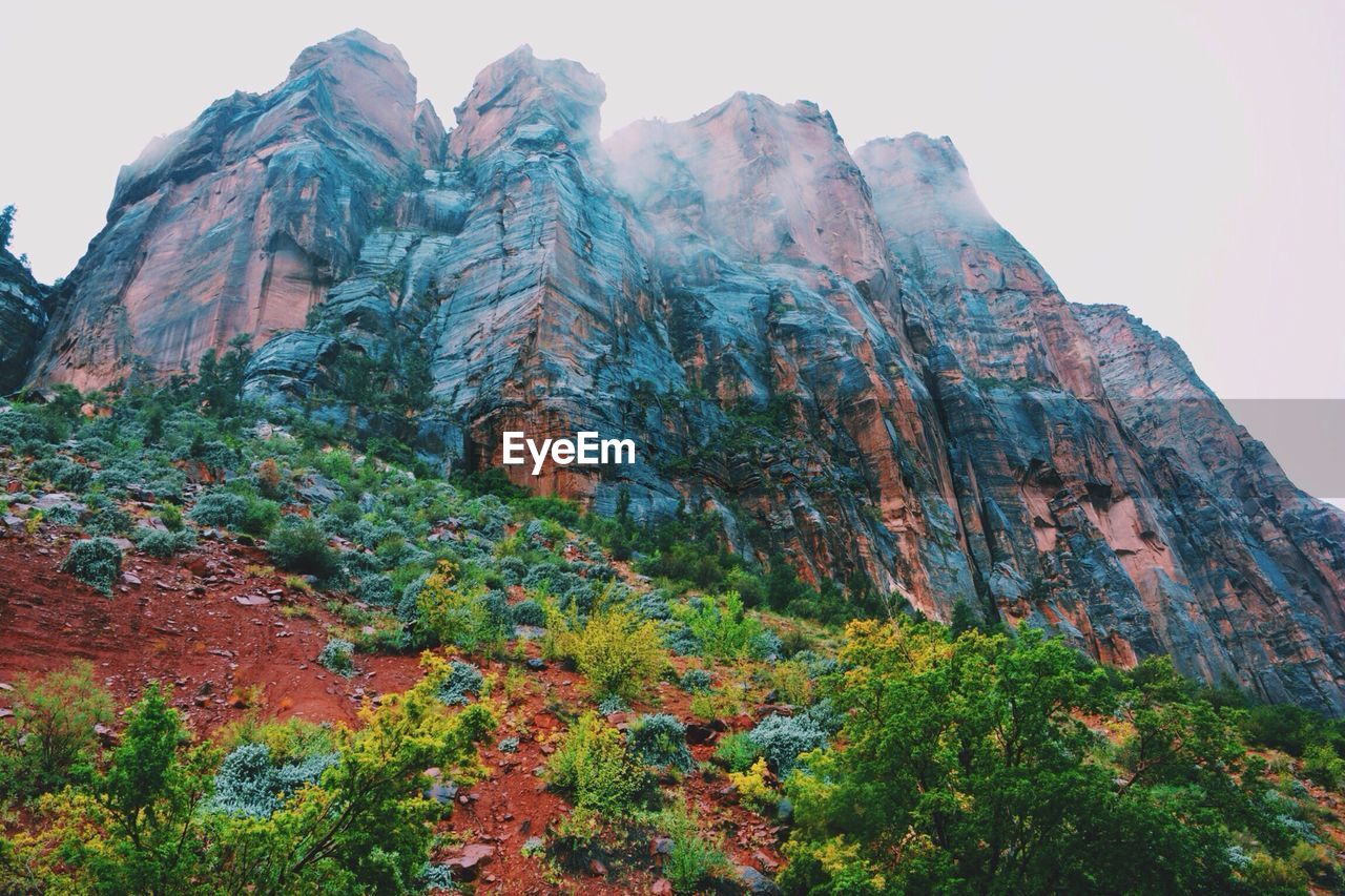 Low angle view of rock formations against the sky