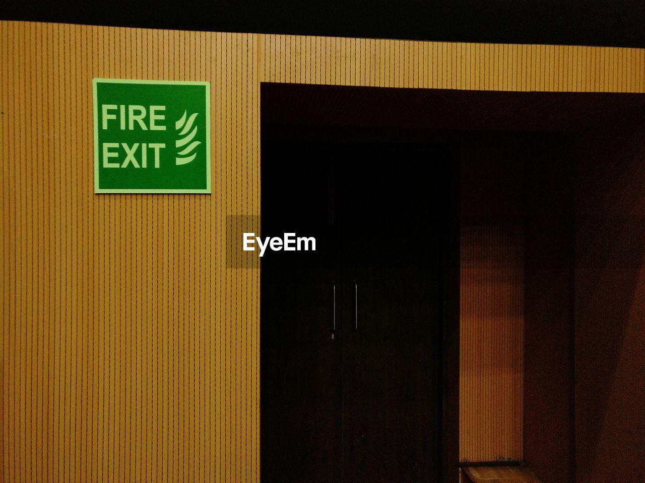 Fire exit door with board