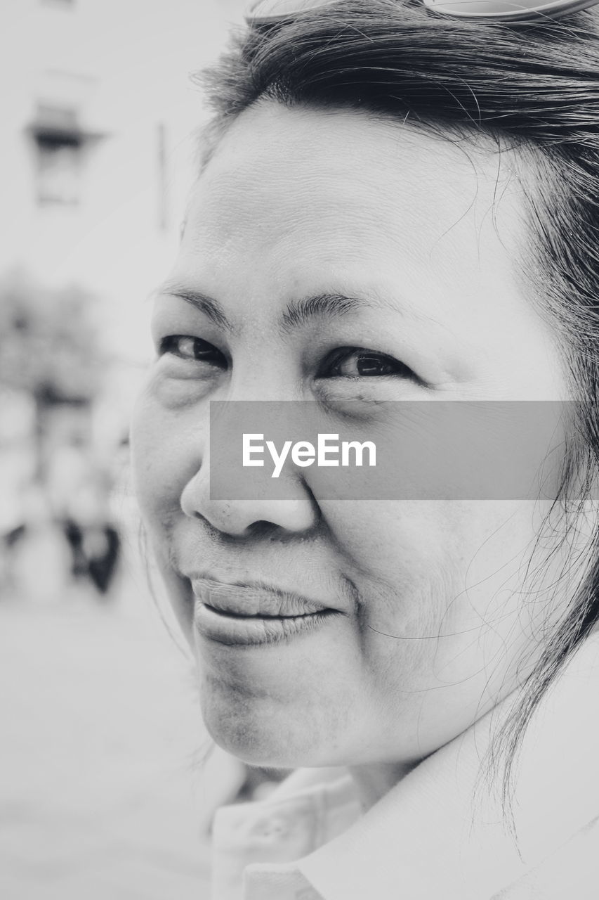 Close-up portrait of smiling woman