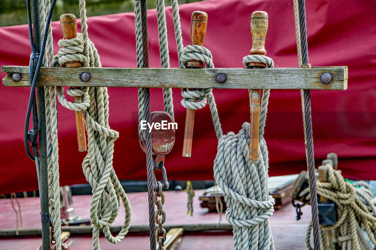 Close-up of chain tied up on metal boat