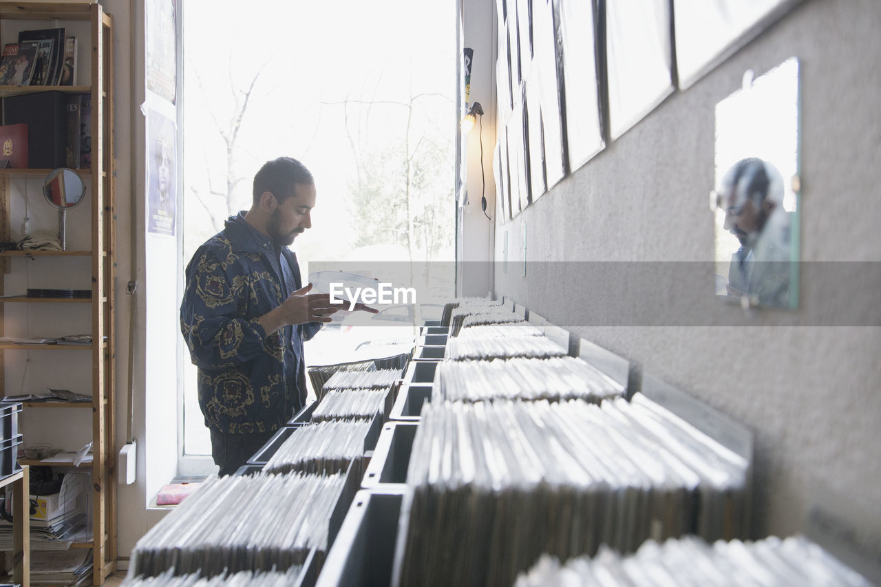 Young man shopping for records