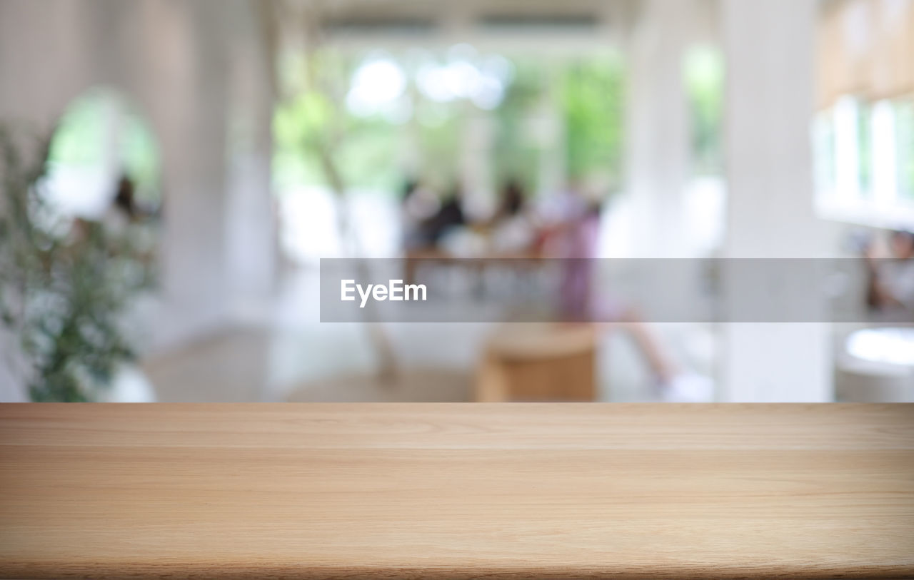 indoors, table, focus on foreground, furniture, room, wood, window, day, home interior, seat, chair, business, no people, domestic room, architecture, selective focus, plant, luxury, nature