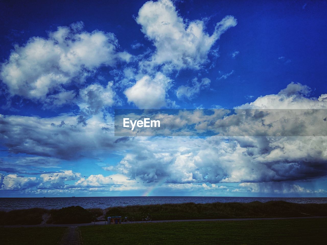 SCENIC VIEW OF LAND AGAINST BLUE SKY