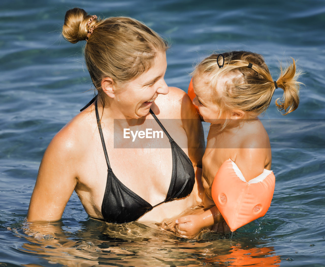 WOMAN IN SWIMMING POOL