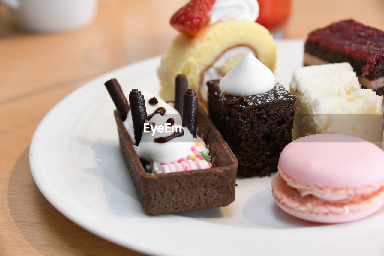 CLOSE-UP OF CAKE SERVED ON TABLE