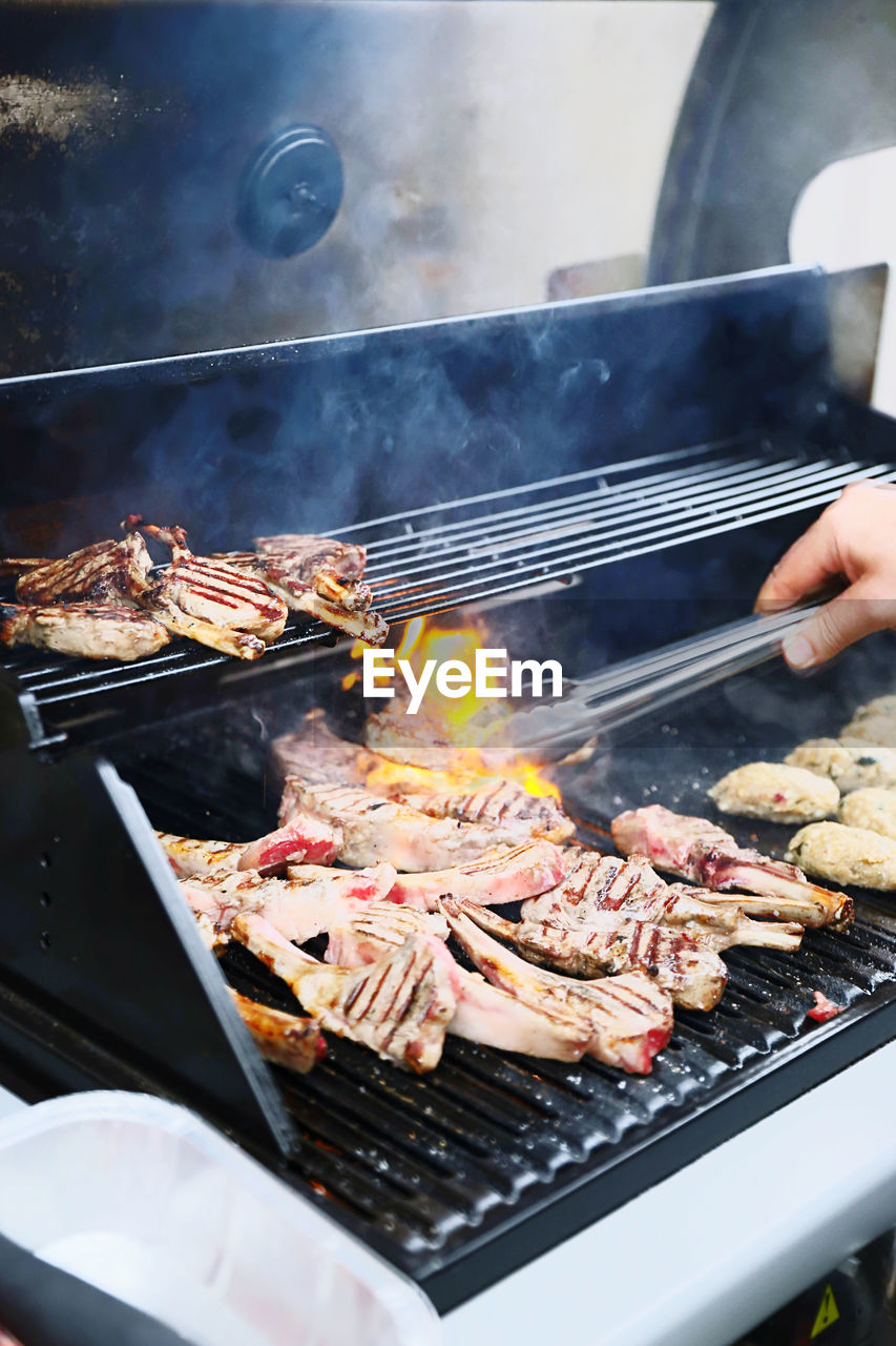 cropped hand of man preparing food