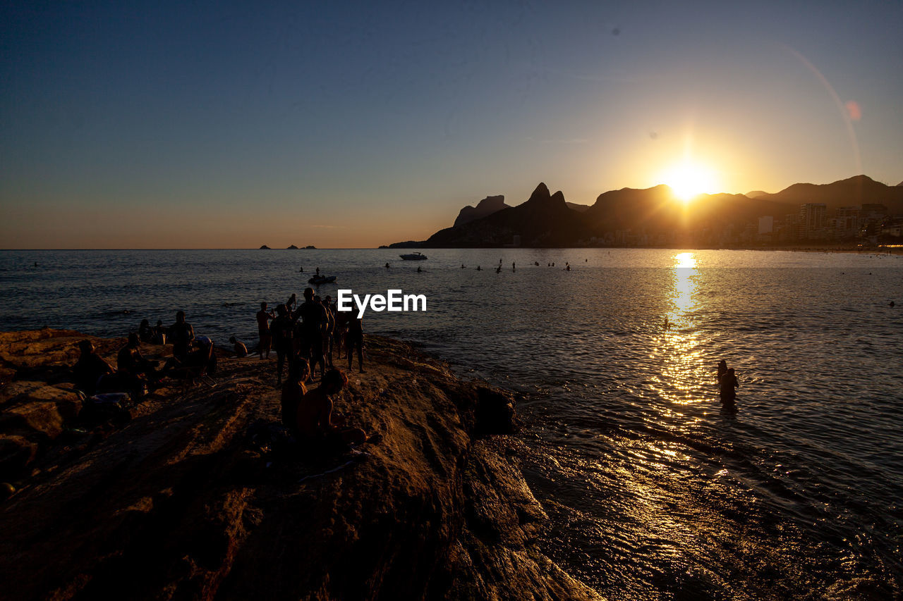 SCENIC VIEW OF SUNSET OVER SEA