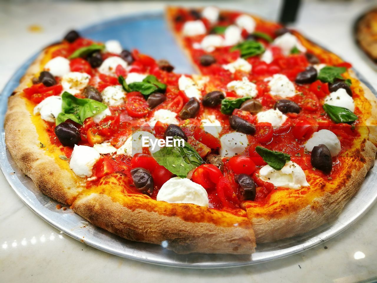 Pizza in plate on table