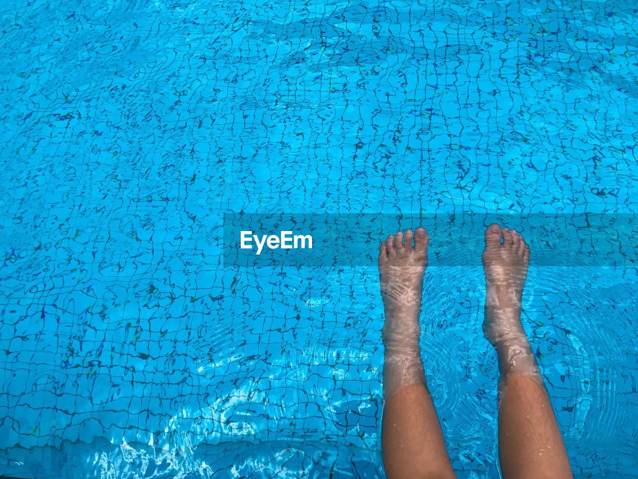 Low section of woman in swimming pool