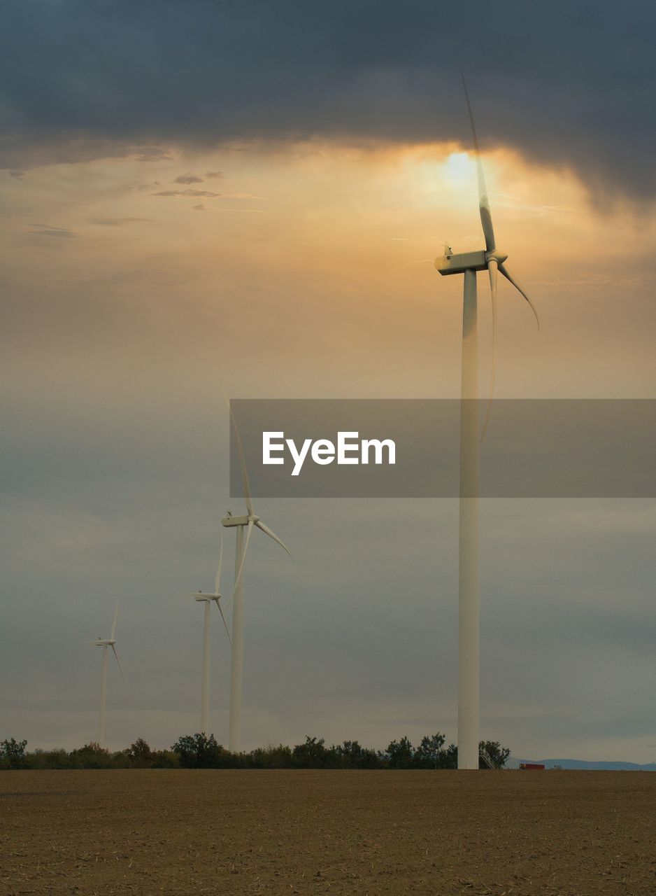 Scenic view of field against sky during sunset