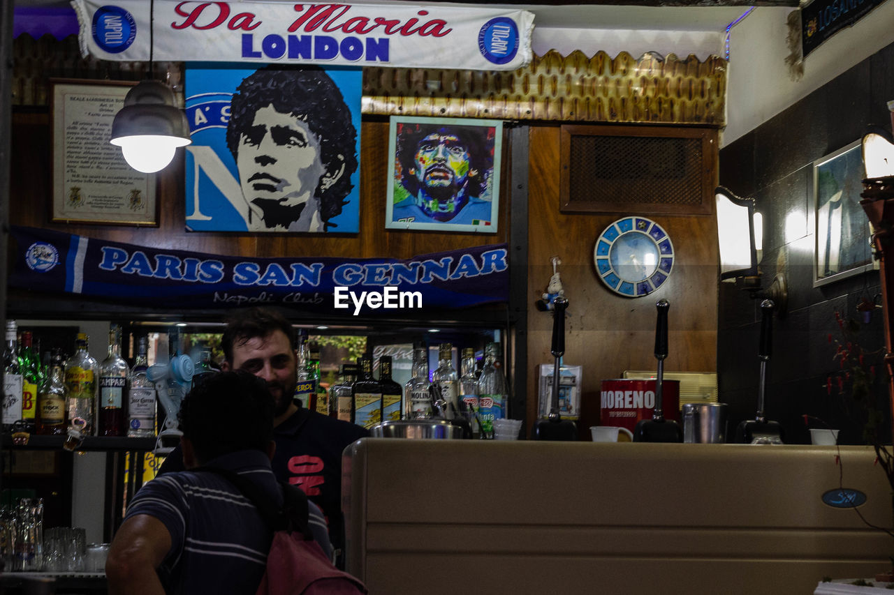 PORTRAIT OF PEOPLE SITTING IN RESTAURANT