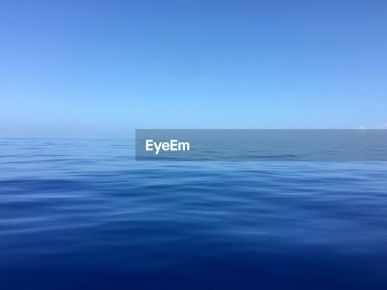 SCENIC VIEW OF SEA AGAINST BLUE SKY