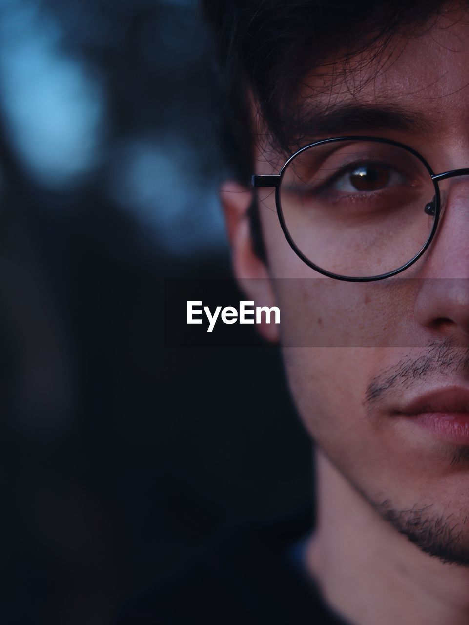 Close-up of young man wearing eyeglasses