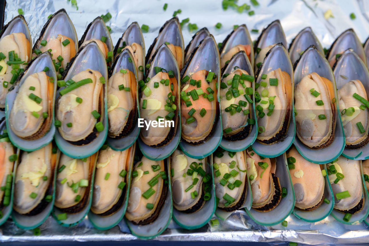 Close-up of mussels in aluminum foil