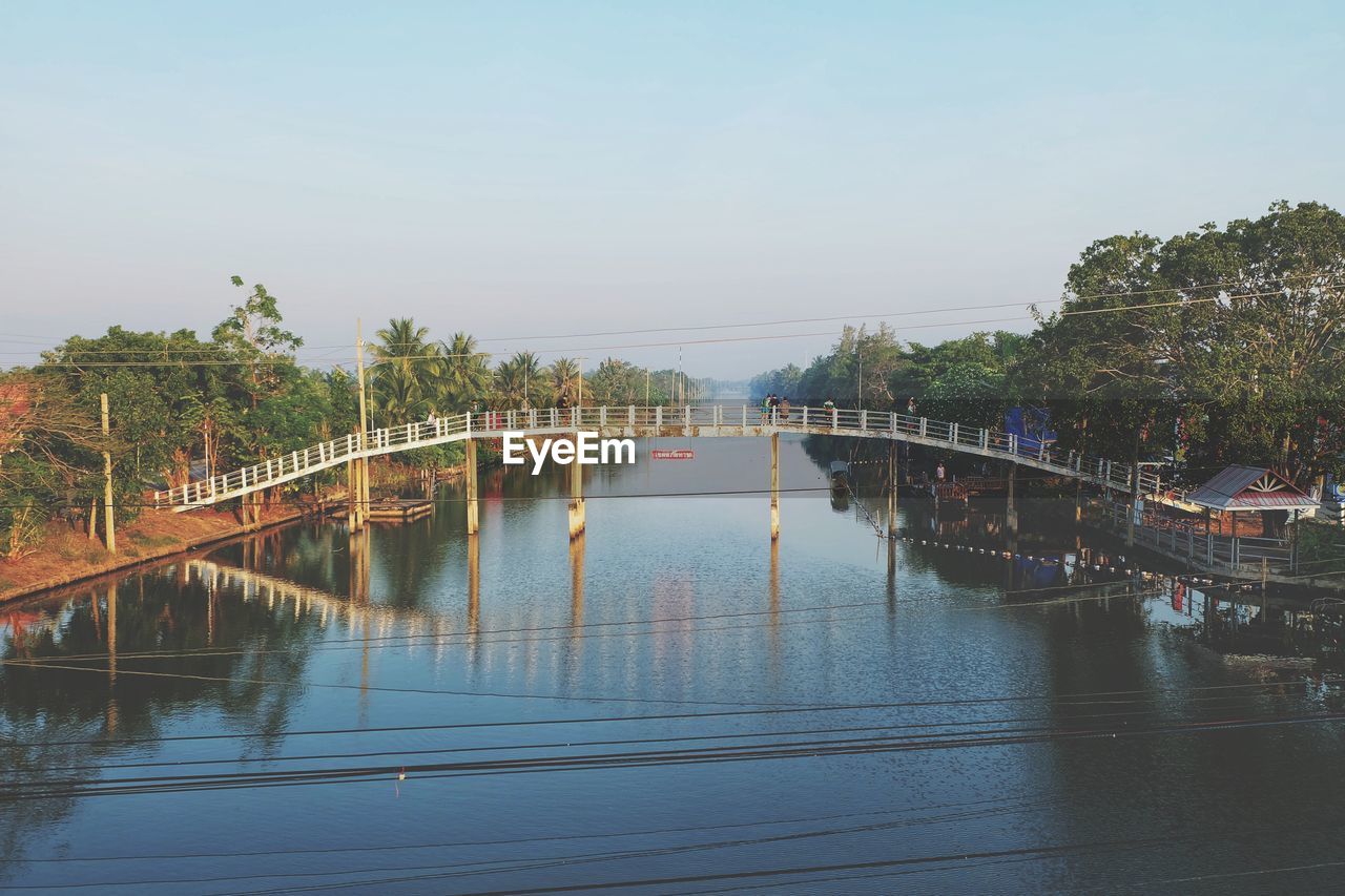 BRIDGE OVER RIVER AGAINST CLEAR SKY