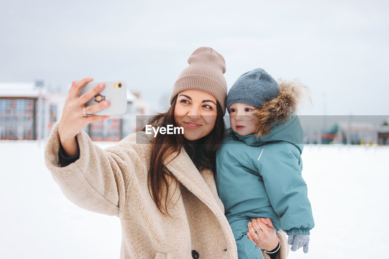 Portrait of a smiling young woman in winter