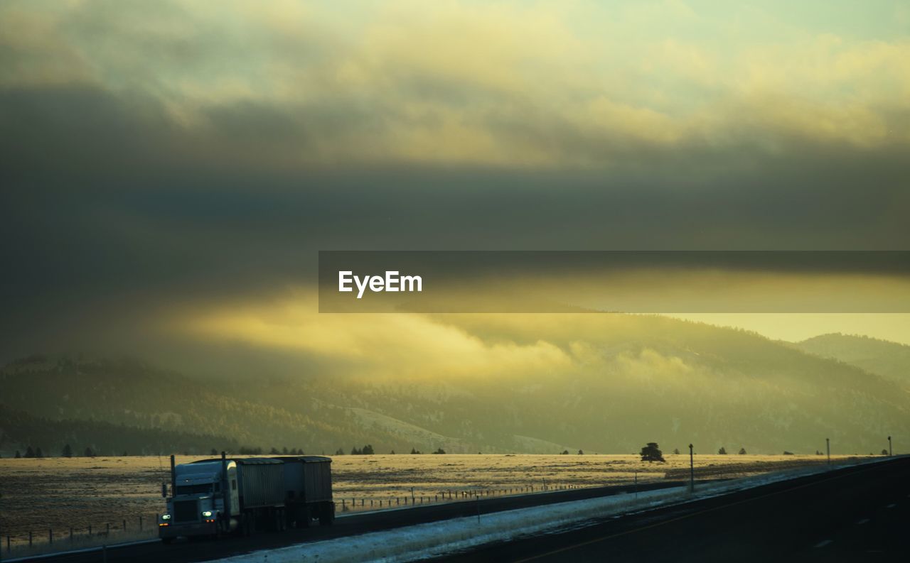 ROAD AGAINST SKY DURING SUNSET