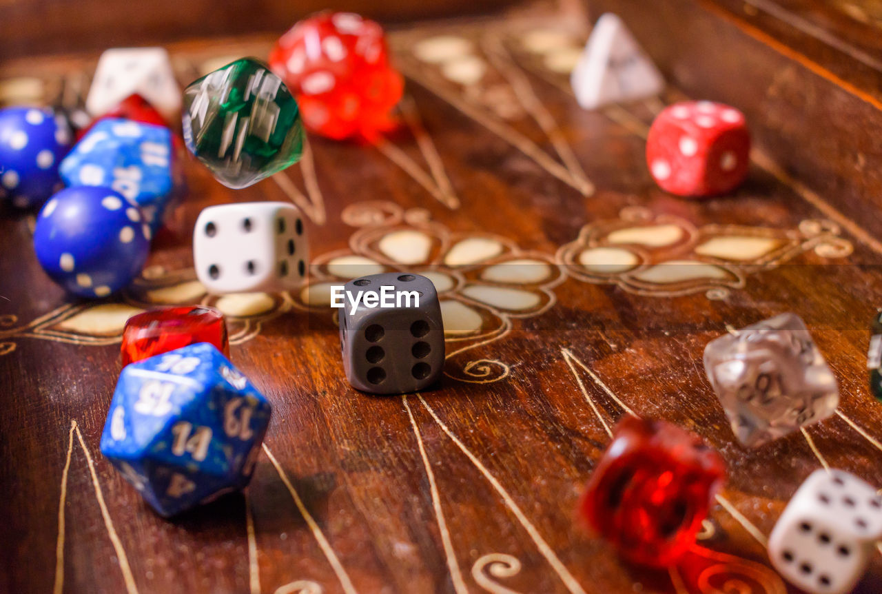 Close-up of dices on wooden table
