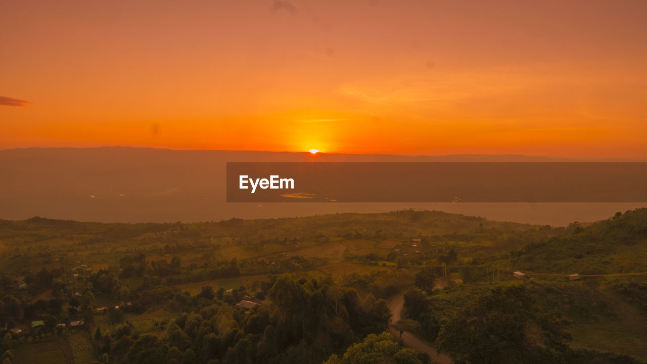 Scenic view of landscape against sky during sunset