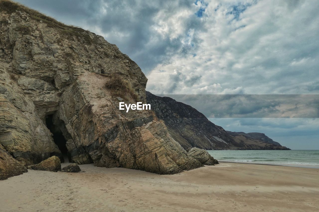 Cave in cliff by beach