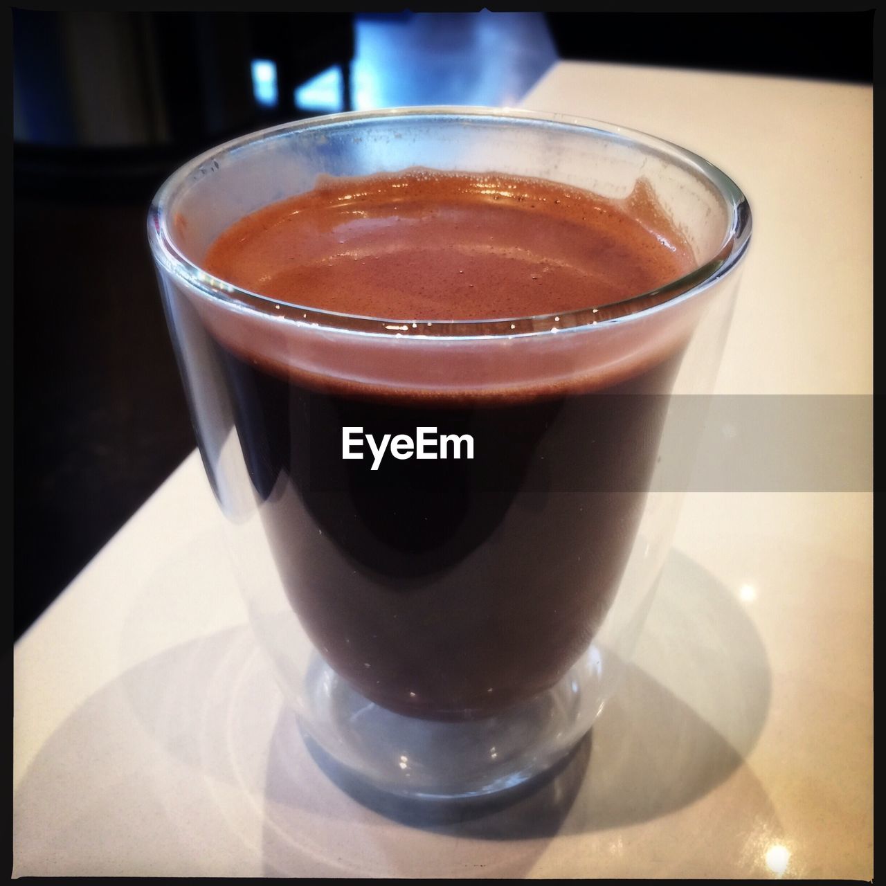 CLOSE-UP OF COFFEE CUP WITH COFFEE CUP