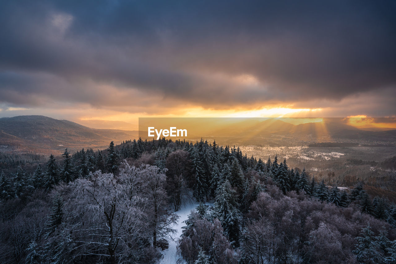 The warm light of the setting sun illuminates the murg valley in the wintry northern black forest