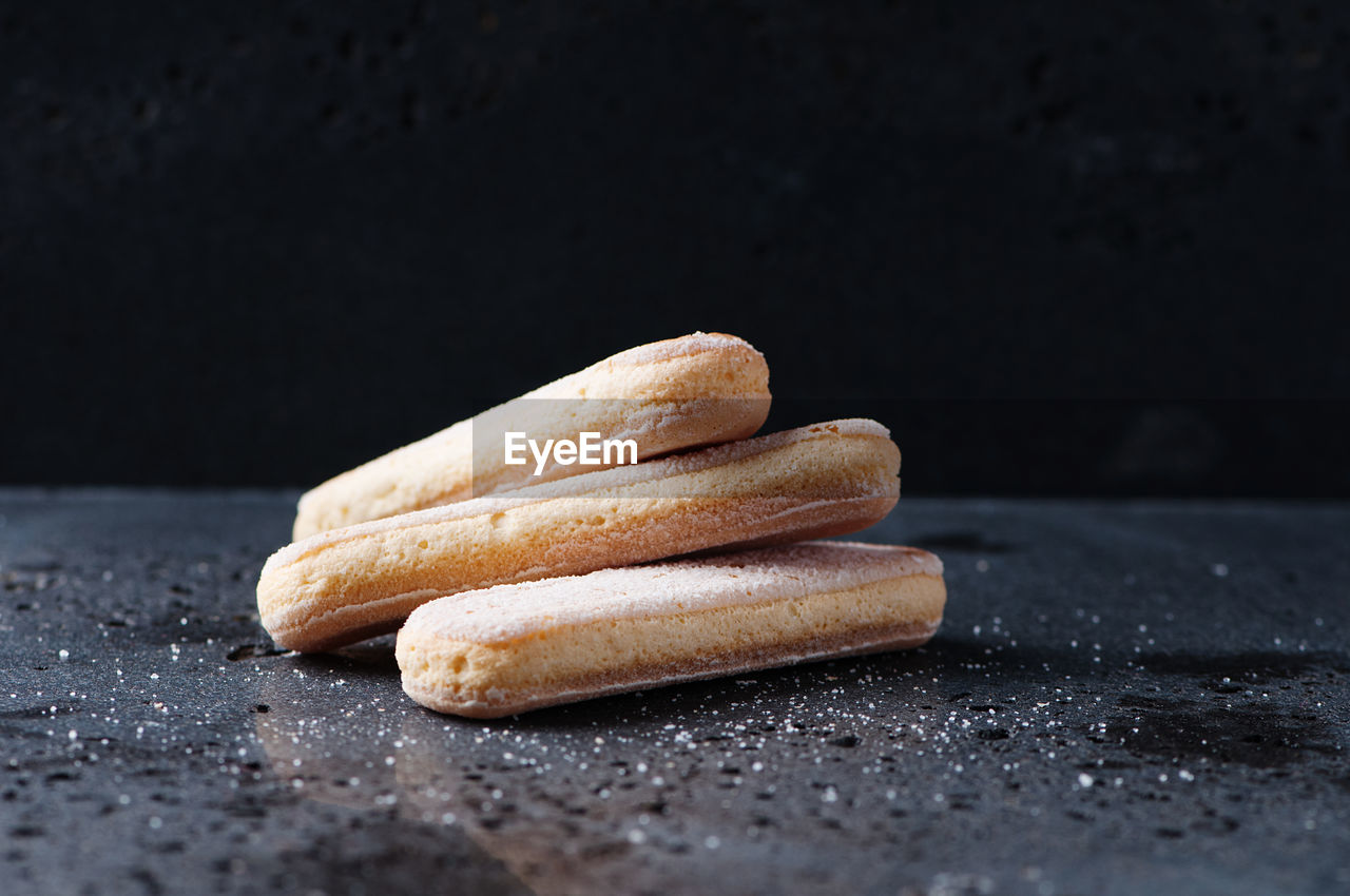 CLOSE-UP OF COOKIES ON WOODEN TABLE