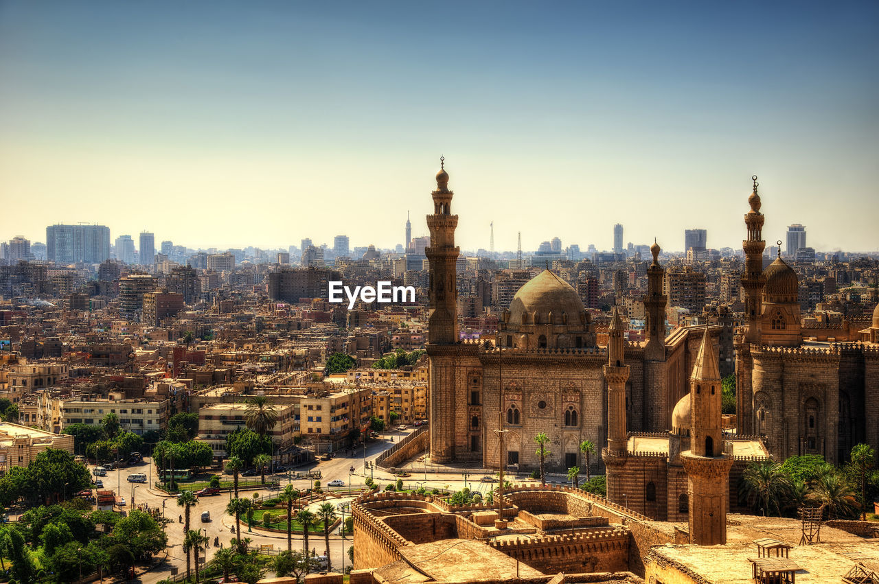 High angle view of city buildings against sky