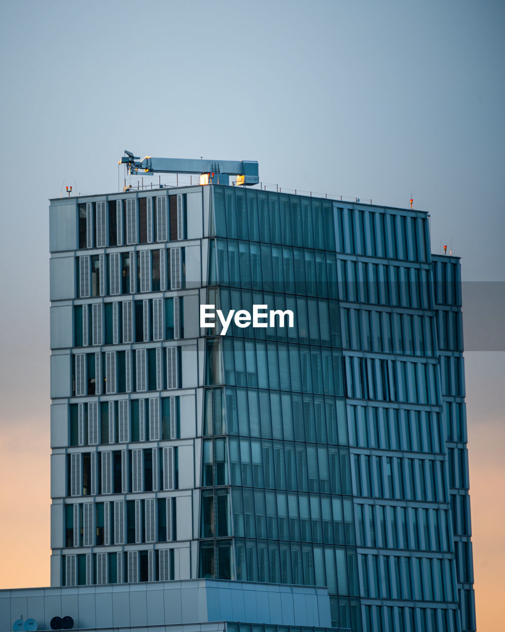 Low angle view of modern building against clear sky in frankfurt, germany 