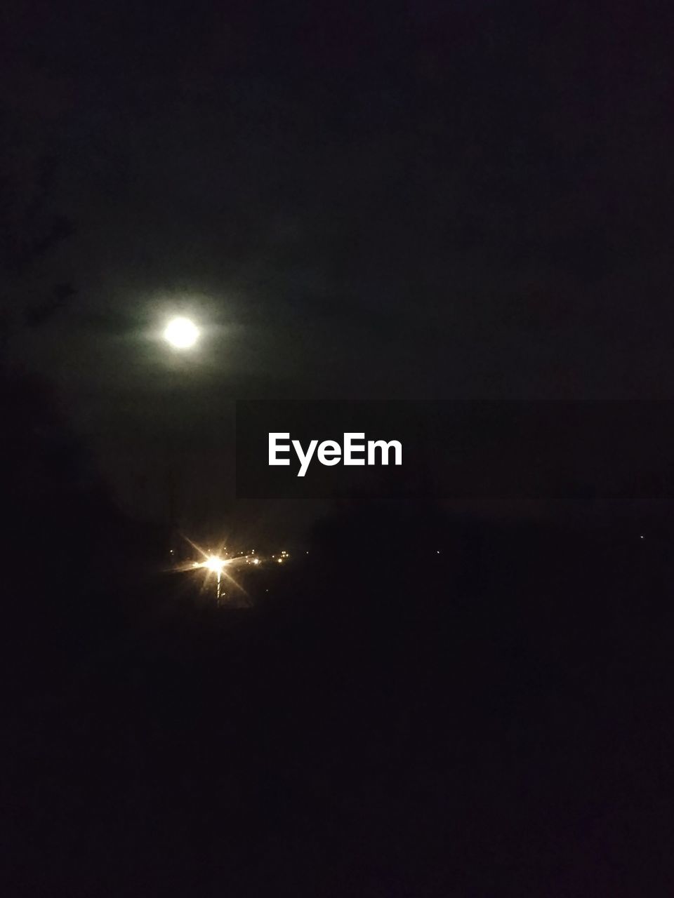 LOW ANGLE VIEW OF ILLUMINATED SKY AT NIGHT