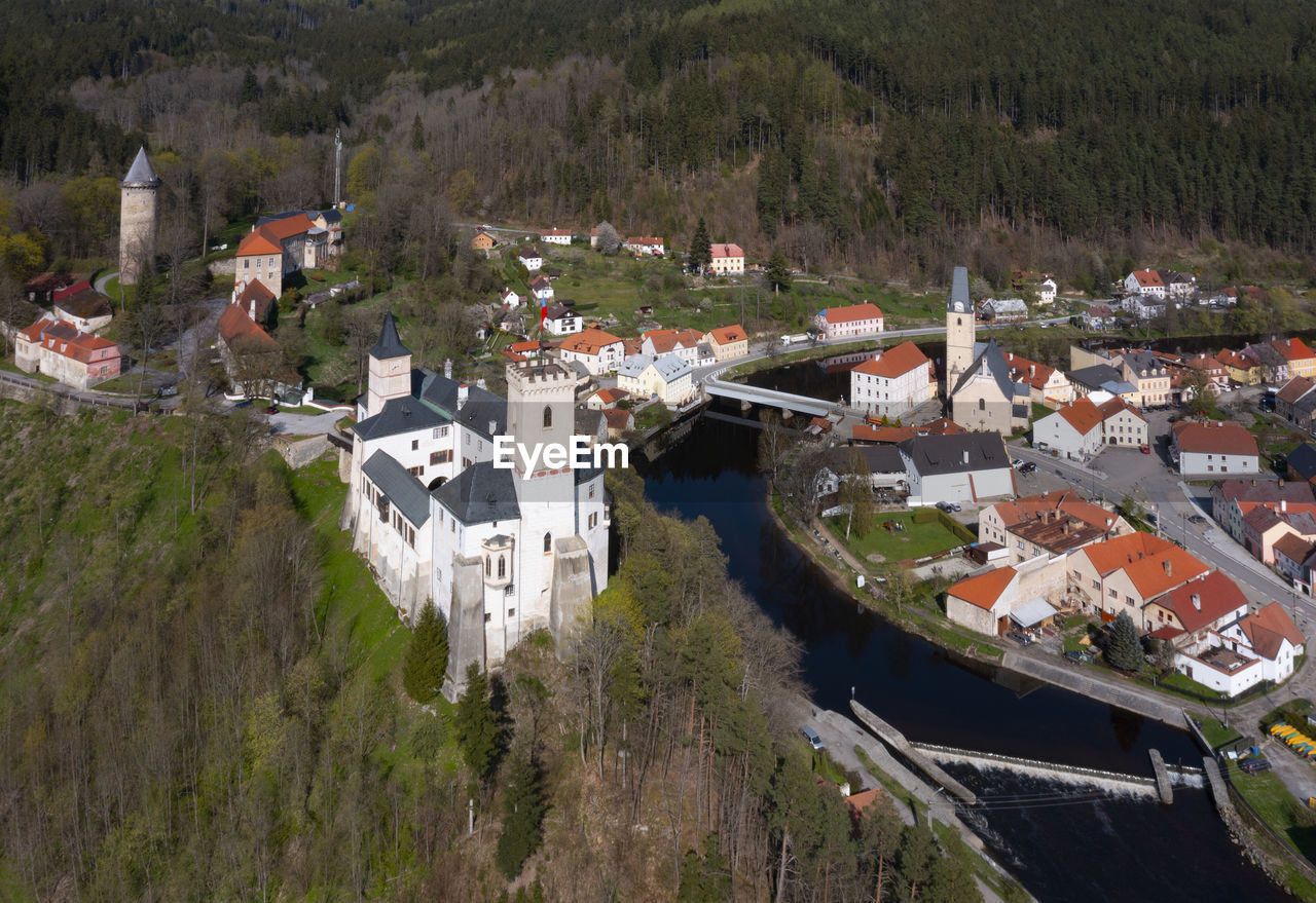 Czech republic, south bohemian region, rozmberk nad vltavou, drone view of rozmberk castle and surrounding town in autumn