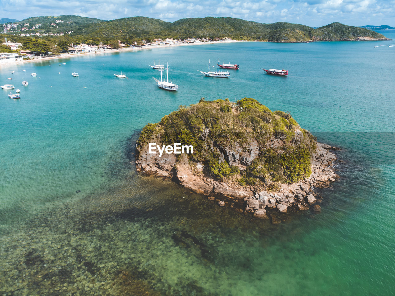 water, sea, land, nautical vessel, scenics - nature, beach, islet, beauty in nature, archipelago, nature, transportation, travel, coast, travel destinations, sky, island, coastline, tranquility, mode of transportation, shore, cove, ocean, tranquil scene, no people, mountain, blue, turquoise colored, holiday, aerial view, idyllic, bay, environment, vacation, day, trip, sailboat, lagoon, yacht, tourism, bay of water, high angle view, body of water, outdoors, rock, landscape, terrain, cloud, ship, summer, tropical climate, tree, seascape, plant, non-urban scene, sailing, harbor, luxury, sunlight, sand, reef, architecture, cliff