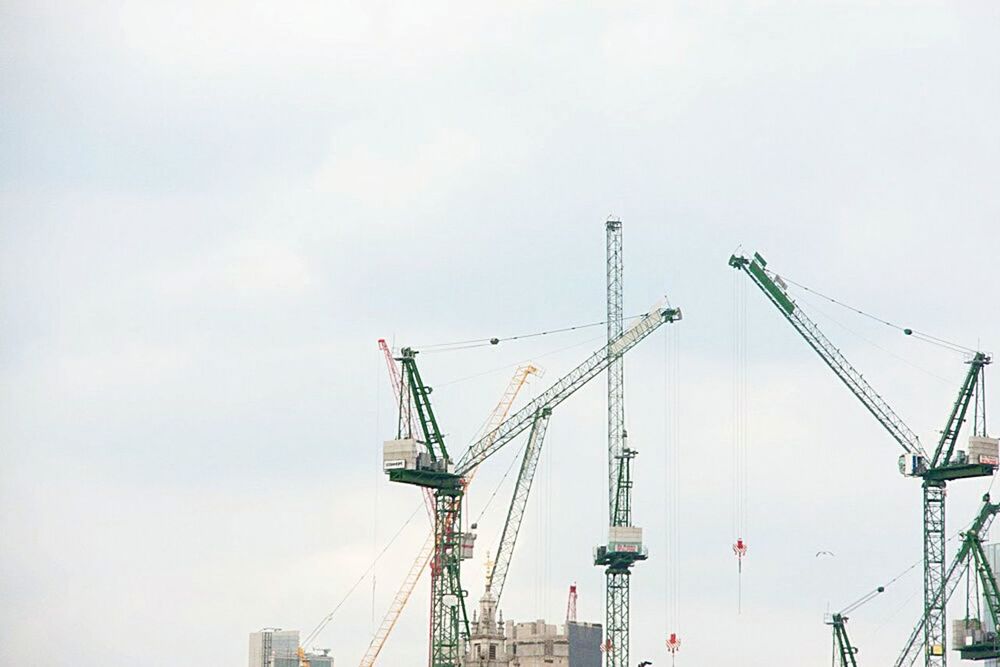 LOW ANGLE VIEW OF CRANE AT CONSTRUCTION SITE