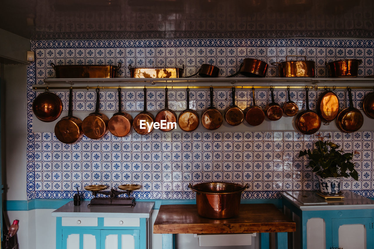 Utensils hanging against wall in kitchen