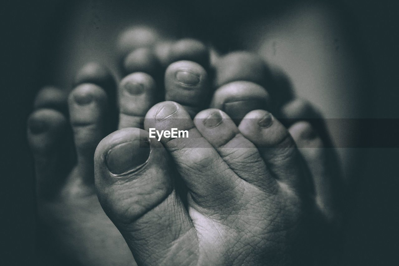 CLOSE-UP OF HUMAN HAND WITH EYES